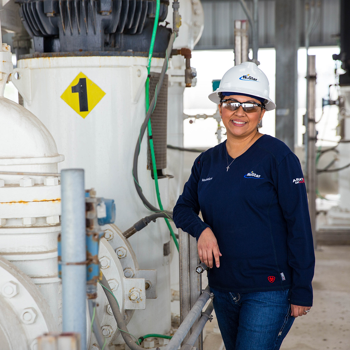 Image of NuStar employee securing a bolt on a vessel at a NuStar plant.